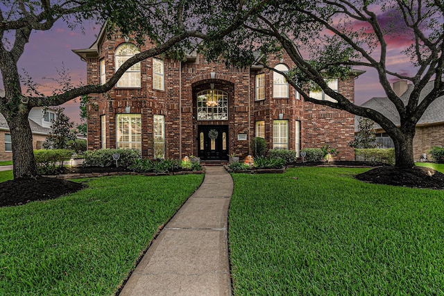 15814 Lake Loop Dr, Cypress, TX 77433 - traditional-style house with a front yard, french doors, and brick siding