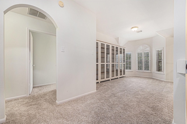 15814 Lake Loop Dr, Cypress, TX 77433 - spare room with carpet, arched walkways, and a smoke detector