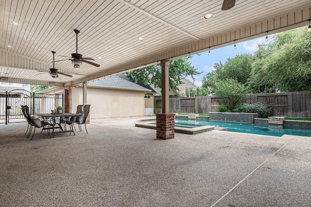 15814 Lake Loop Dr, Cypress, TX 77433 - fenced backyard featuring ceiling fan, a patio, and a pool with connected hot tub