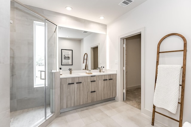 4024 Boho Ln, Houston, TX 77045 - full bath featuring double vanity, a stall shower, tile patterned floors, baseboards, and recessed lighting