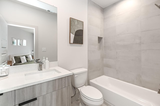 4024 Boho Ln, Houston, TX 77045 - bathroom featuring toilet, vanity, and washtub / shower combination