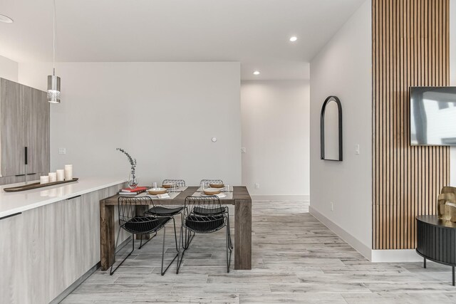 4024 Boho Ln, Houston, TX 77045 - dining area featuring recessed lighting, light wood-style floors, and baseboards