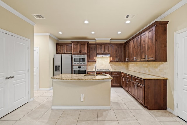 1121 Beall Landing Ct, Houston, TX 77008 - kitchen featuring stainless steel appliances, a sink, light stone counters, light tile patterned floors, and crown molding