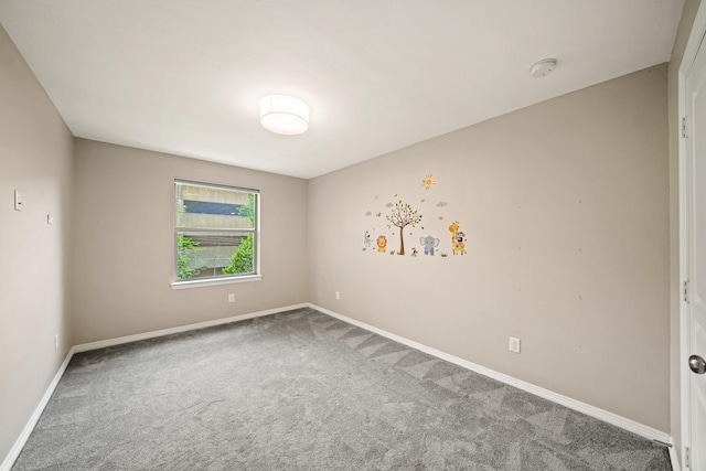 1121 Beall Landing Ct, Houston, TX 77008 - unfurnished room featuring carpet floors, a smoke detector, and baseboards