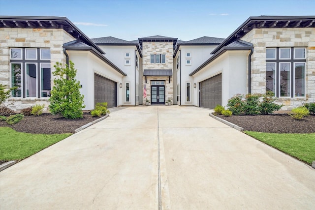 11011 Heartleaf Aster Way, Cypress, TX 77433 - view of front of house with stone siding, a garage, french doors, and concrete driveway