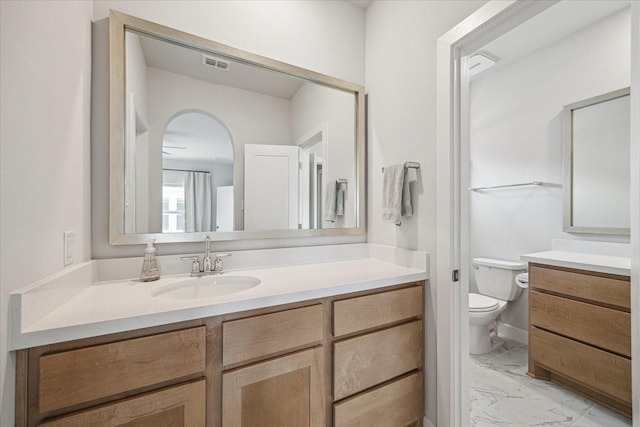 11011 Heartleaf Aster Way, Cypress, TX 77433 - bathroom featuring vanity, marble finish floors, and toilet