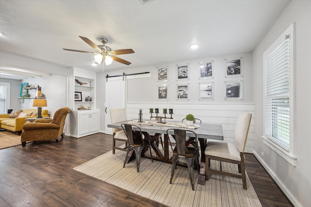 711 S Tesch St, Bellville, TX 77418 - dining area featuring a barn door, healthy amount of natural light, dark wood-style floors, ceiling fan, and recessed lighting