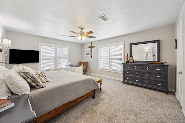 711 S Tesch St, Bellville, TX 77418 - bedroom with baseboards, ceiling fan, and light carpet