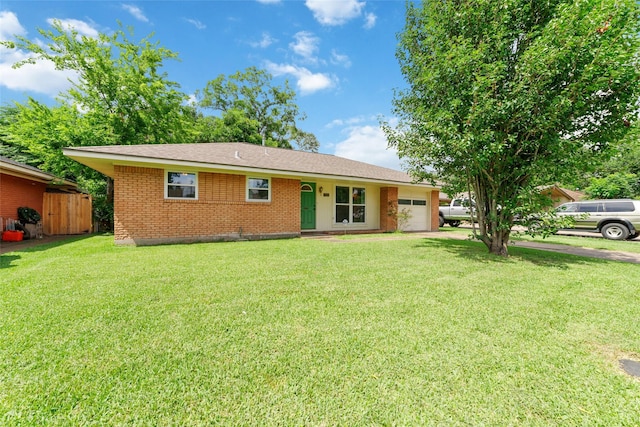 6601 Roos Rd, Houston, TX 77074 - ranch-style home featuring an attached garage, brick siding, and driveway