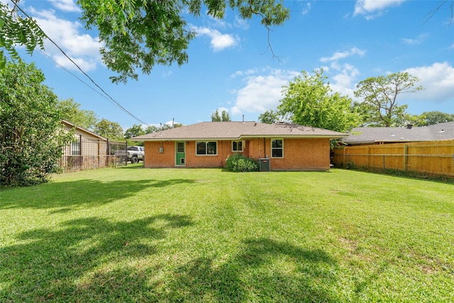 6601 Roos Rd, Houston, TX 77074 - rear view of property with brick siding and central air condition unit