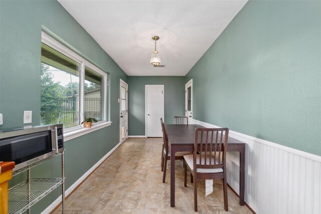 6601 Roos Rd, Houston, TX 77074 - dining room with stone finish floors and baseboards