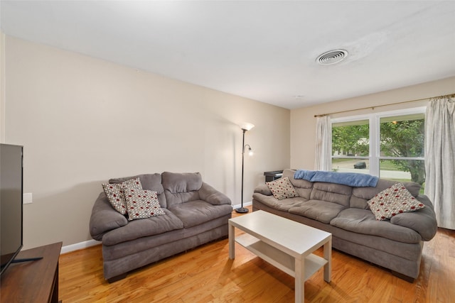 6601 Roos Rd, Houston, TX 77074 - living room featuring light wood-type flooring and baseboards