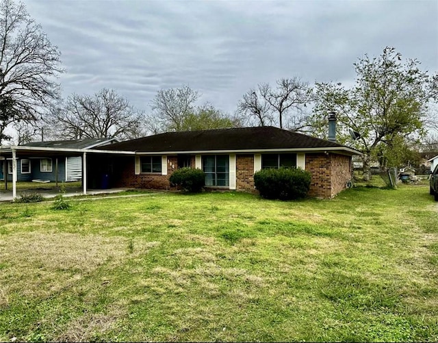 1008 Brockman St, Sweeny, TX 77480 - ranch-style house featuring a front yard and brick siding