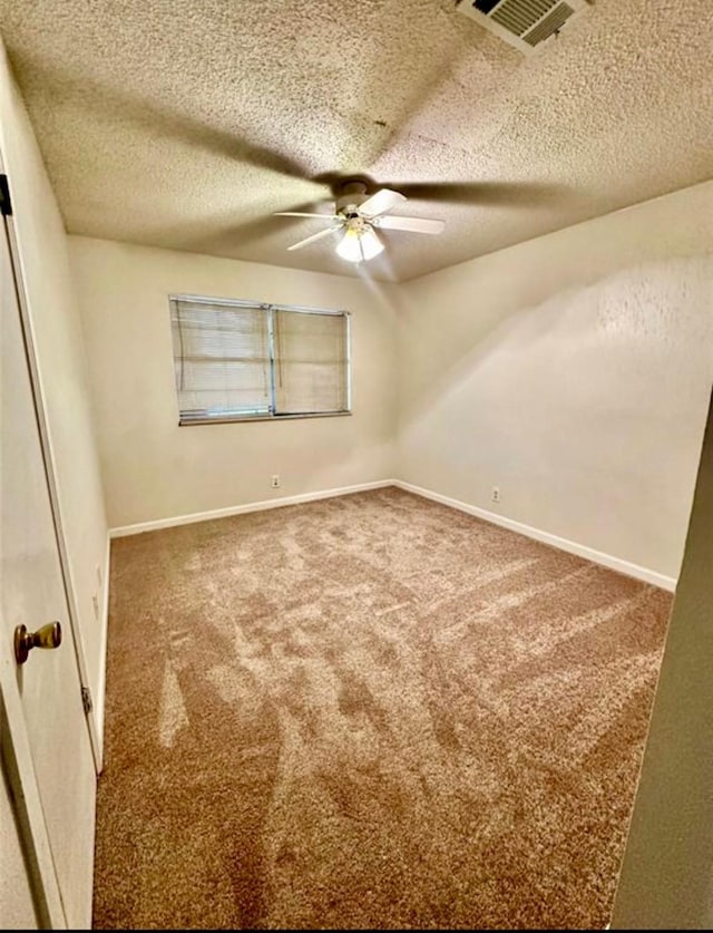1008 Brockman St, Sweeny, TX 77480 - carpeted empty room featuring ceiling fan, a textured ceiling, and baseboards