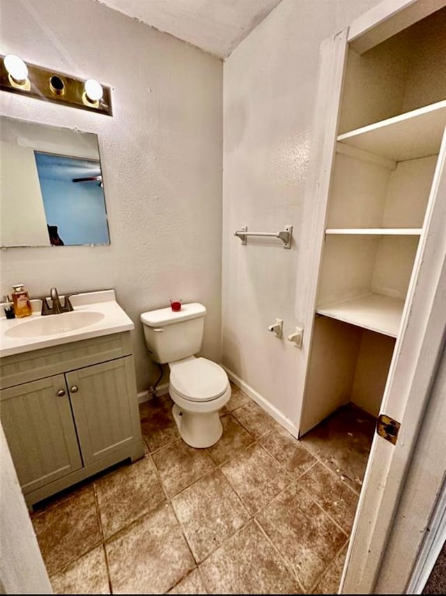 1008 Brockman St, Sweeny, TX 77480 - bathroom with vanity, toilet, and baseboards