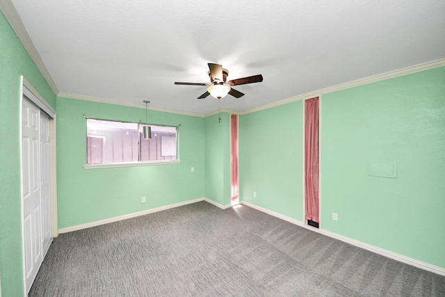 6304 Crab Orchard Rd, Houston, TX 77057 - unfurnished bedroom with a closet, baseboards, crown molding, carpet floors, and a ceiling fan