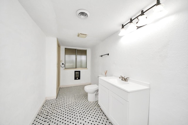 6304 Crab Orchard Rd, Houston, TX 77057 - bathroom with vanity, toilet, baseboards, and tile patterned floors