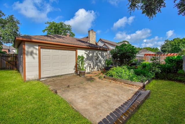 1610 Chapelwood Ln, Richmond, TX 77406 - garage with driveway and a garden