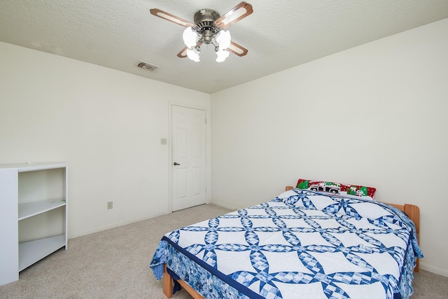 1610 Chapelwood Ln, Richmond, TX 77406 - bedroom with carpet flooring, baseboards, a ceiling fan, and a textured ceiling