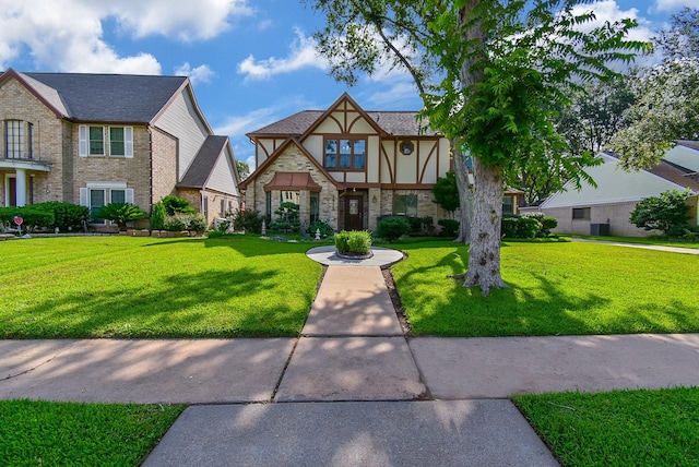 1610 Chapelwood Ln, Richmond, TX 77406 - view of front of property featuring stone siding, a front lawn, and stucco siding