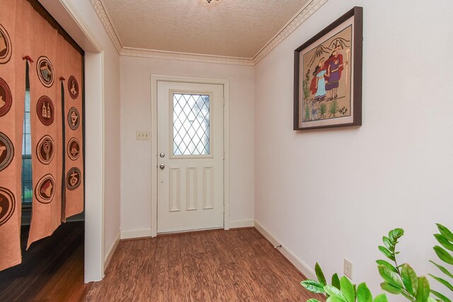 1610 Chapelwood Ln, Richmond, TX 77406 - entrance foyer with dark wood-style floors, a textured ceiling, baseboards, and crown molding