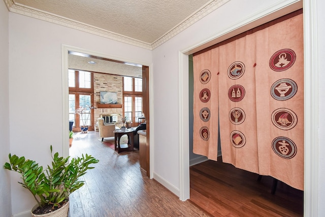1610 Chapelwood Ln, Richmond, TX 77406 - hall featuring dark wood finished floors, a textured ceiling, baseboards, and crown molding