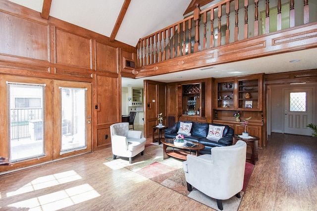 1610 Chapelwood Ln, Richmond, TX 77406 - living area featuring high vaulted ceiling, wood finished floors, and wood walls