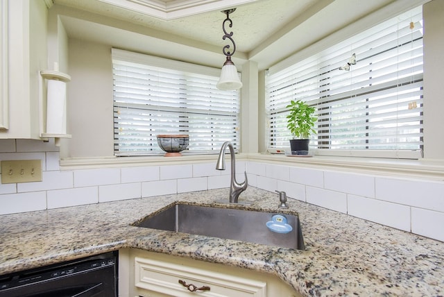 1610 Chapelwood Ln, Richmond, TX 77406 - kitchen with a sink, black dishwasher, tasteful backsplash, light stone countertops, and pendant lighting