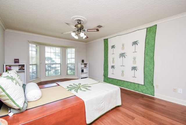 1610 Chapelwood Ln, Richmond, TX 77406 - bedroom featuring wood finished floors, ornamental molding, baseboards, a textured ceiling, and ceiling fan