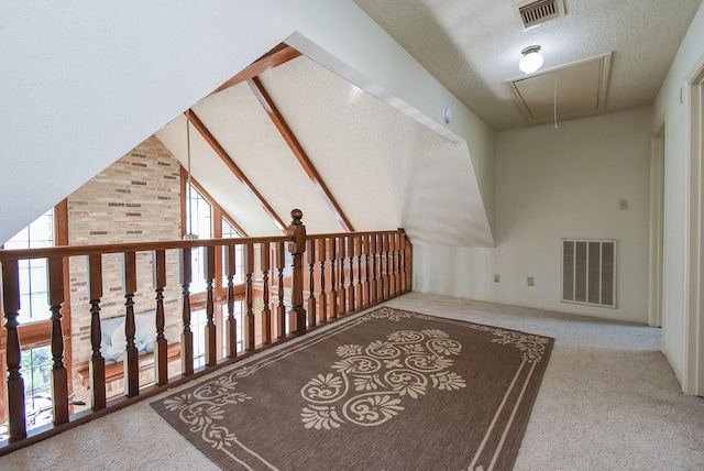 1610 Chapelwood Ln, Richmond, TX 77406 - additional living space featuring attic access, a textured ceiling, and carpet flooring