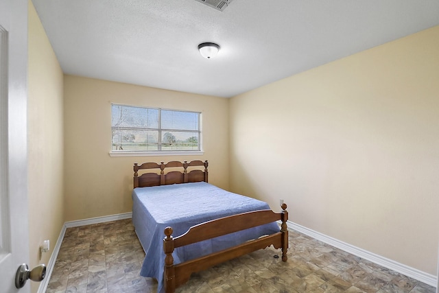 11221 State Highway 65, Winnie, TX 77665 - bedroom featuring baseboards