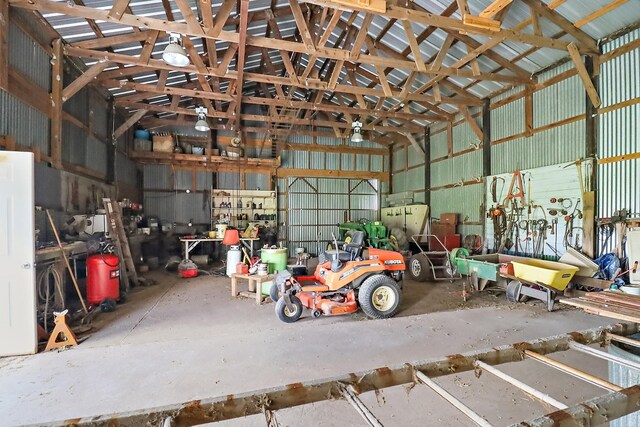 11221 State Highway 65, Winnie, TX 77665 - garage with metal wall