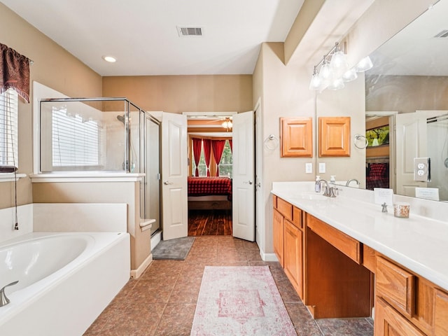 1003 Commons Waterway Dr, Huffman, TX 77336 - bathroom with a shower stall, a bath, ensuite bathroom, vanity, and recessed lighting
