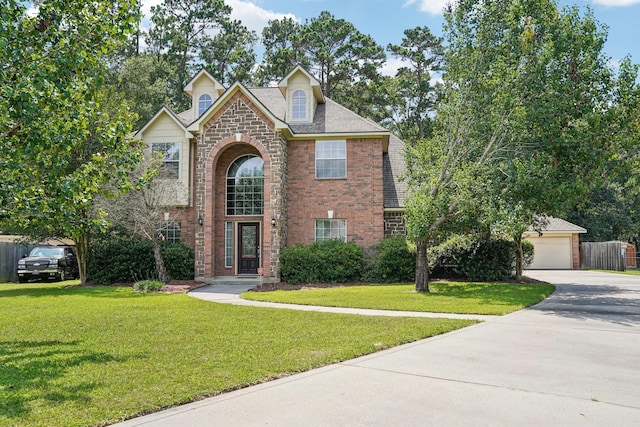 1003 Commons Waterway Dr, Huffman, TX 77336 - traditional home with brick siding, a garage, and driveway
