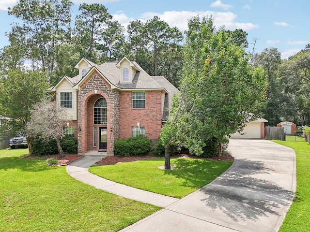 1003 Commons Waterway Dr, Huffman, TX 77336 - traditional-style home with brick siding, concrete driveway, and a garage