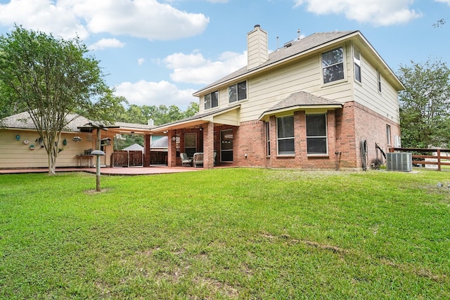 1003 Commons Waterway Dr, Huffman, TX 77336 - back of house with central AC, a patio area, a chimney, and brick siding