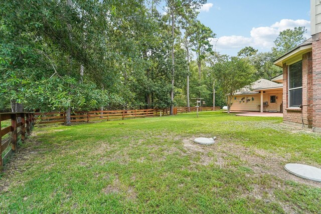 1003 Commons Waterway Dr, Huffman, TX 77336 - view of yard featuring a patio