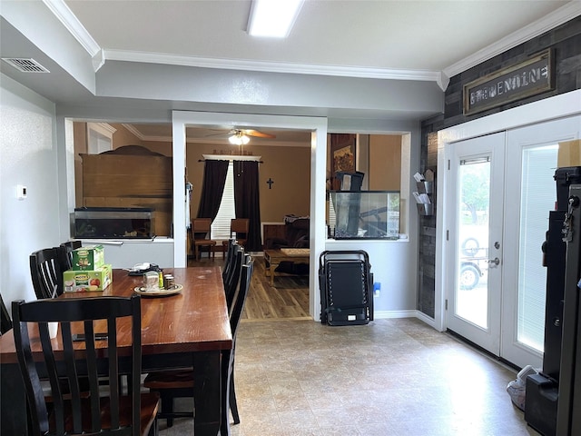 120 N 10th Ave, Teague, TX 75860 - dining space featuring ornamental molding, french doors, healthy amount of natural light, a ceiling fan, and baseboards