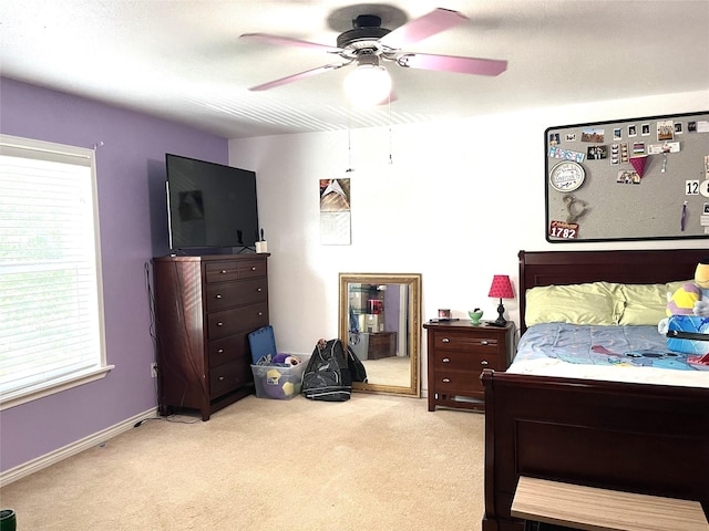 120 N 10th Ave, Teague, TX 75860 - bedroom with light colored carpet and a ceiling fan