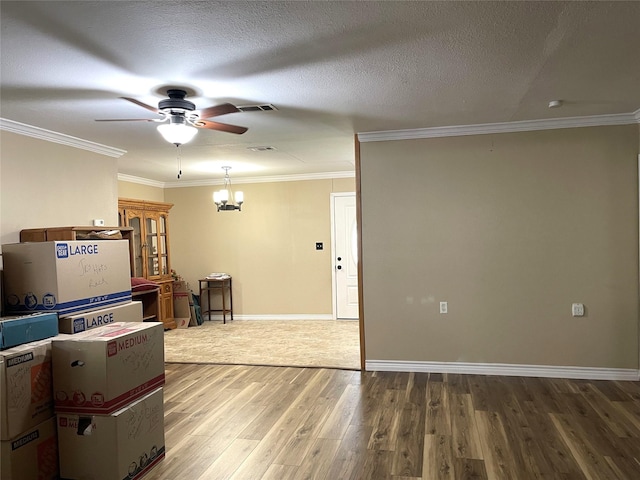 120 N 10th Ave, Teague, TX 75860 - living room with ceiling fan, wood finished floors, crown molding, a chandelier, and baseboards