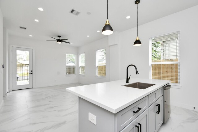 849 Mansfield St Unit E, Houston, TX 77091 - kitchen featuring light marble finish flooring, recessed lighting, a ceiling fan, pendant lighting, and light countertops