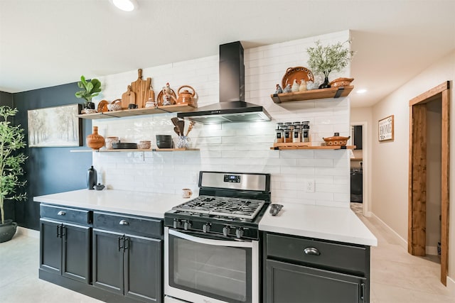 21100 Titian Dr, Magnolia, TX 77355 - kitchen featuring open shelves, stainless steel range with gas stovetop, wall chimney exhaust hood, and tasteful backsplash