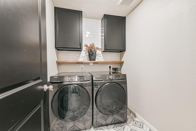 21100 Titian Dr, Magnolia, TX 77355 - washroom featuring washer and clothes dryer, cabinet space, and baseboards