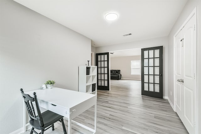 21100 Titian Dr, Magnolia, TX 77355 - office with french doors, baseboards, and light wood-style flooring