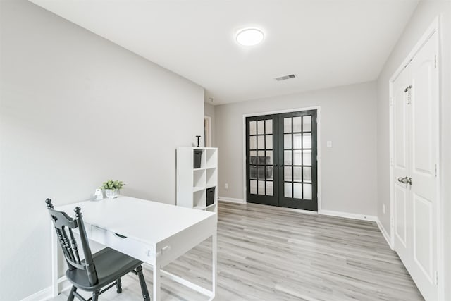 21100 Titian Dr, Magnolia, TX 77355 - office area with french doors, light wood finished floors, and baseboards