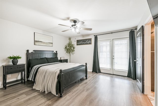 21100 Titian Dr, Magnolia, TX 77355 - bedroom featuring access to exterior, light wood-type flooring, a ceiling fan, and baseboards