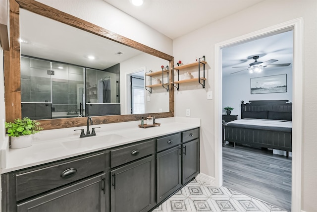 21100 Titian Dr, Magnolia, TX 77355 - full bath featuring double vanity, ensuite bathroom, a stall shower, ceiling fan, and baseboards