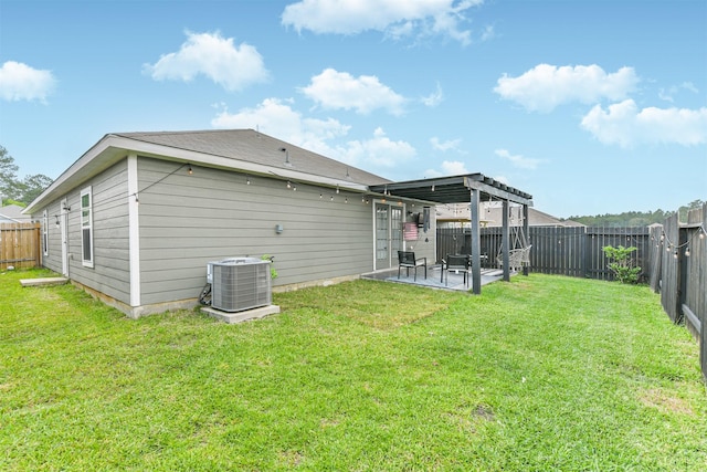 21100 Titian Dr, Magnolia, TX 77355 - rear view of property featuring central AC unit and a patio area