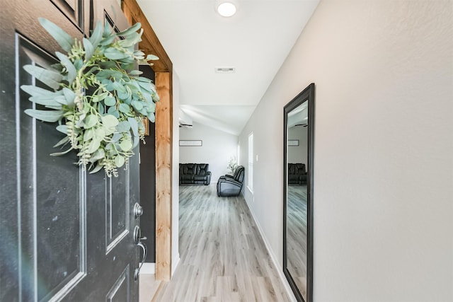 21100 Titian Dr, Magnolia, TX 77355 - entryway with lofted ceiling, wood finished floors, and baseboards