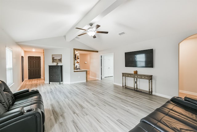 21100 Titian Dr, Magnolia, TX 77355 - living area featuring arched walkways, a ceiling fan, light wood-type flooring, and baseboards